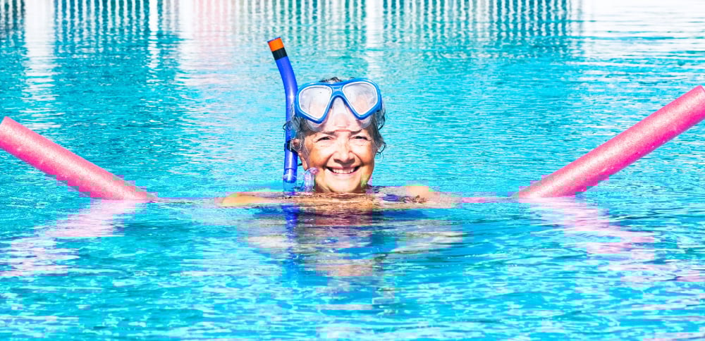 active-senior-woman-doing-exercise-in-swimming-poo-2024-11-02-23-36-31-utc-2