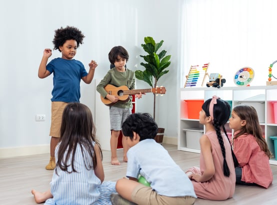 group-of-mixed-race-young-little-kid-playing-guita-2023-11-27-04-59-56-utc