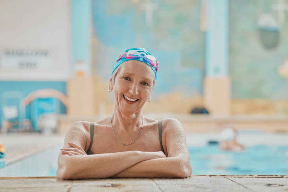 senior-woman-swimmer-in-water-and-relax-in-swimmi-2023-11-27-04-57-02-utc-2